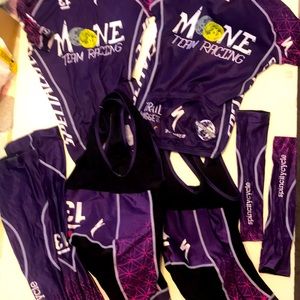 2 full cycling kits-2 m bibs, m leg warmers, 2 small jerseys, small arm warmers